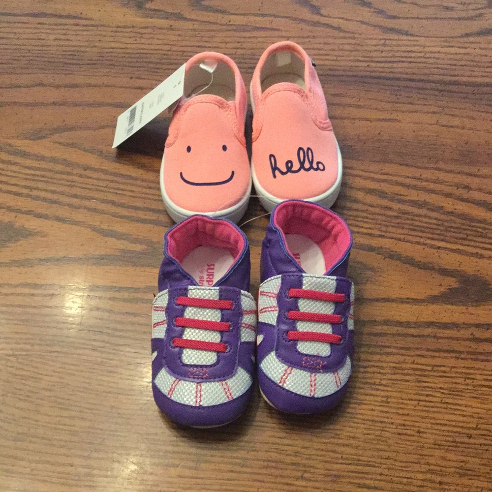 Two pairs of new baby shoes